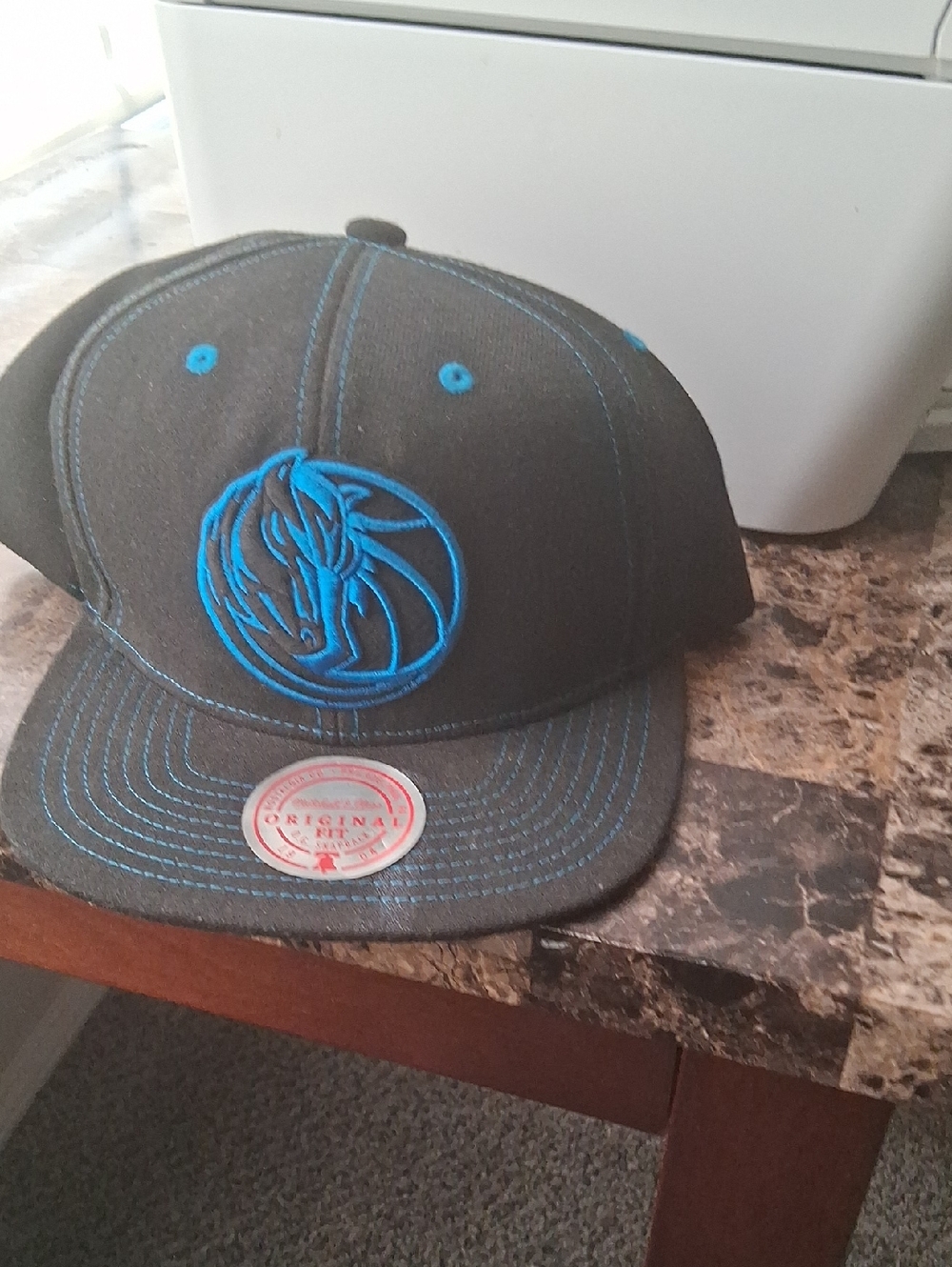 Black Snapback Hat with Bright Blue Embroidered Logo